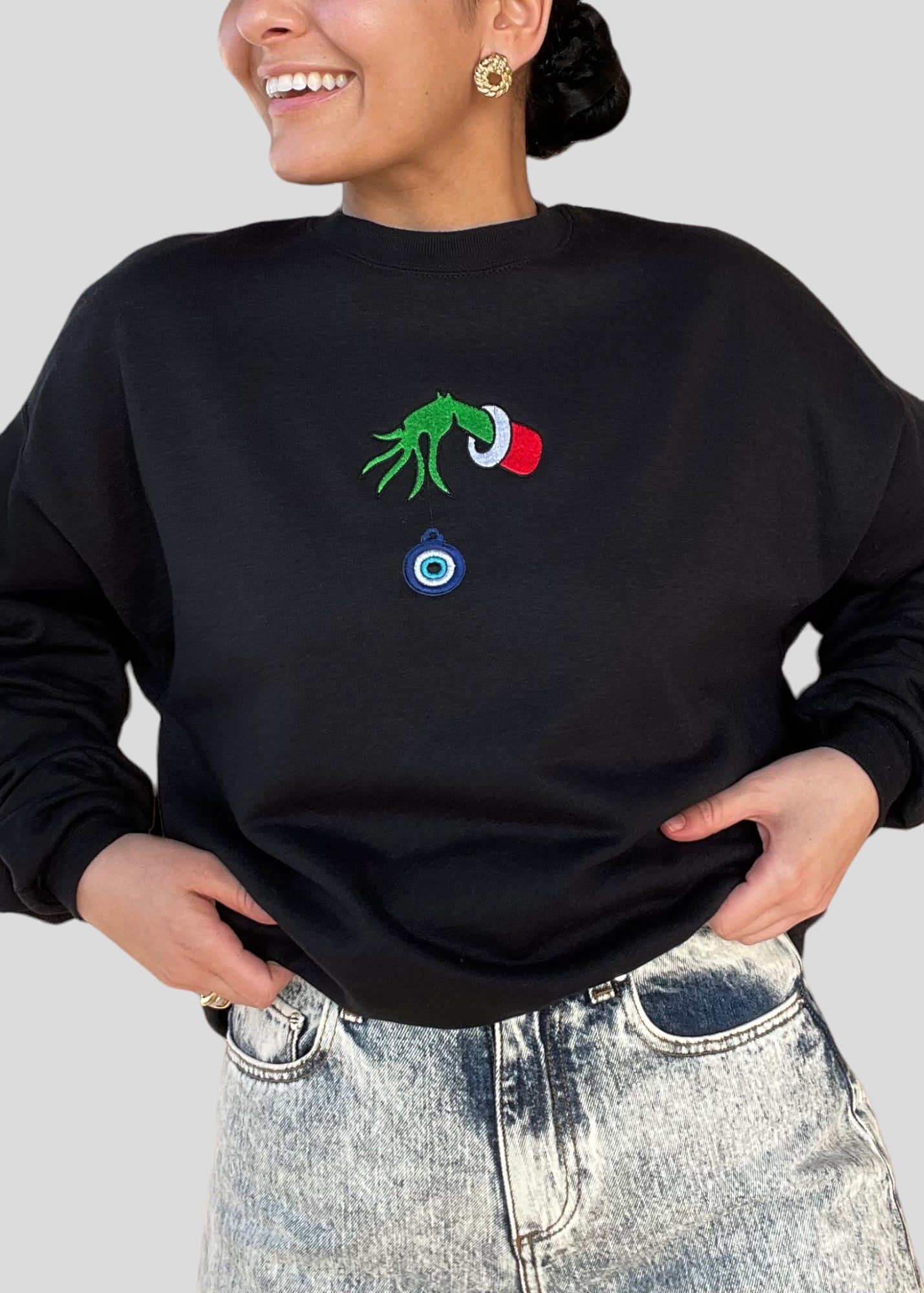 Embroidered Grinch Hand with Evil Eye Ornament Sweatshirts