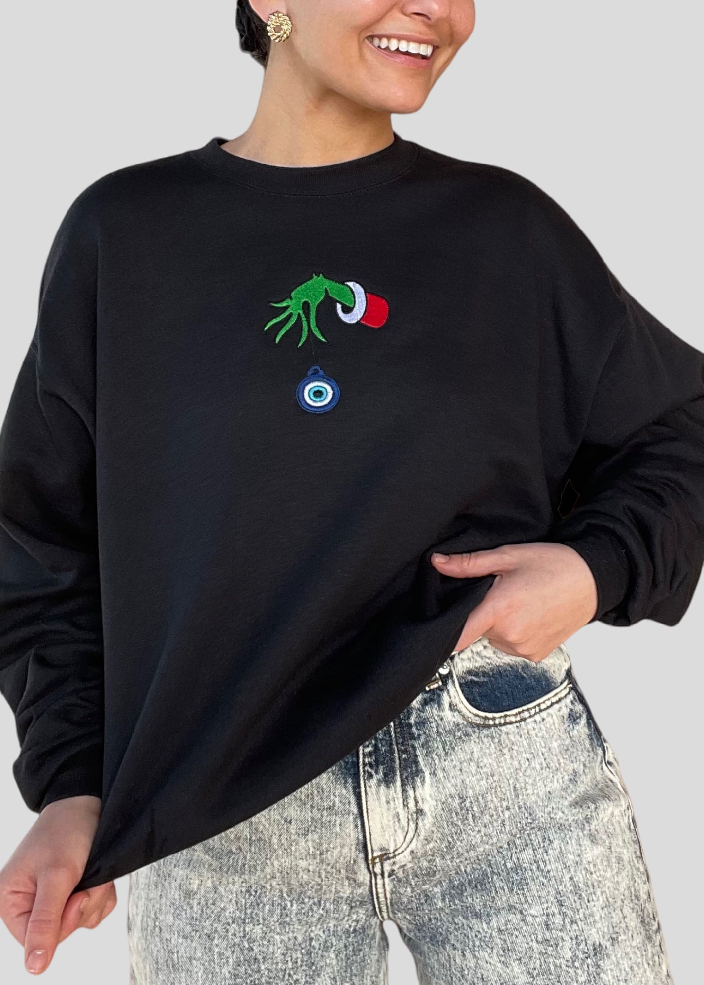 Embroidered Grinch Hand with Evil Eye Ornament Sweatshirts