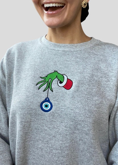 Embroidered Grinch Hand with Evil Eye Ornament Sweatshirts