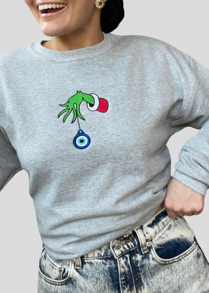 Embroidered Grinch Hand with Evil Eye Ornament Sweatshirts